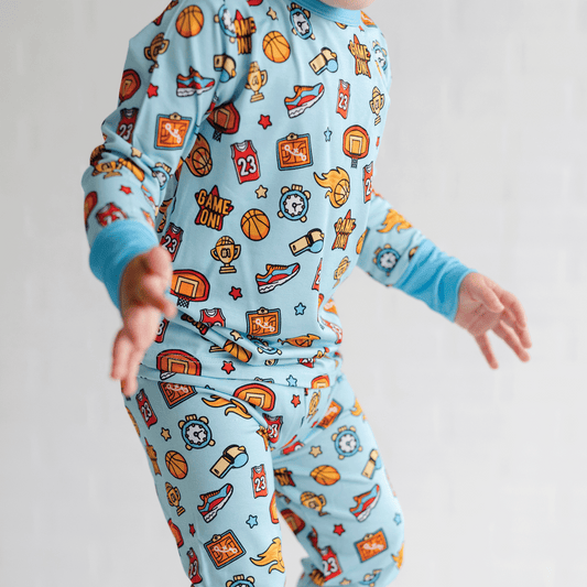 Basketball-themed pajamas for toddler to youth sizes, made with soft bamboo fabric for a cozy and comfortable sleep.