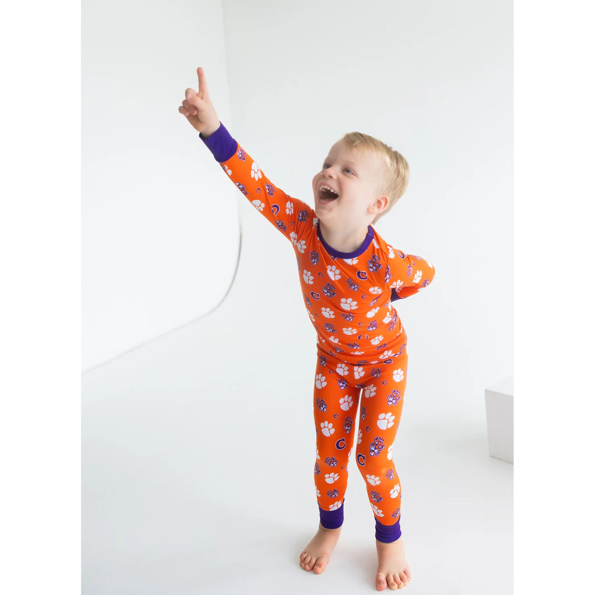 Clemson Tigers Two-Piece Pajama Se With Long Sleeves And Pants and paw mark print.