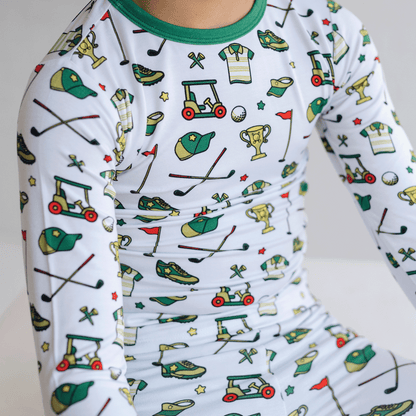 Golf-themed pajamas for toddler to youth sizes, made with soft bamboo fabric for a cozy and comfortable sleep.