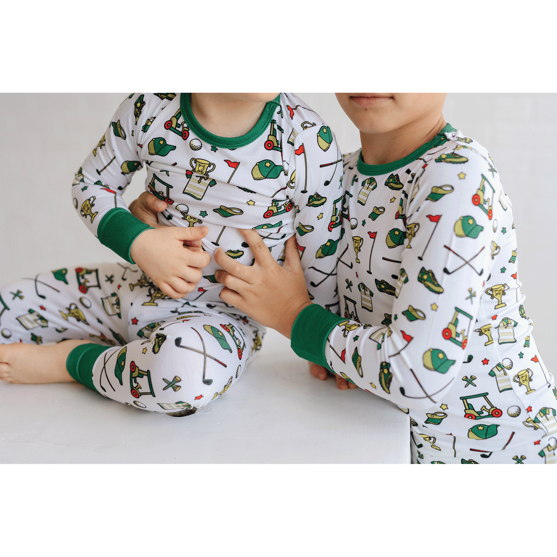 Golf-themed pajamas for toddler to youth sizes, made with soft bamboo fabric for a cozy and comfortable sleep.