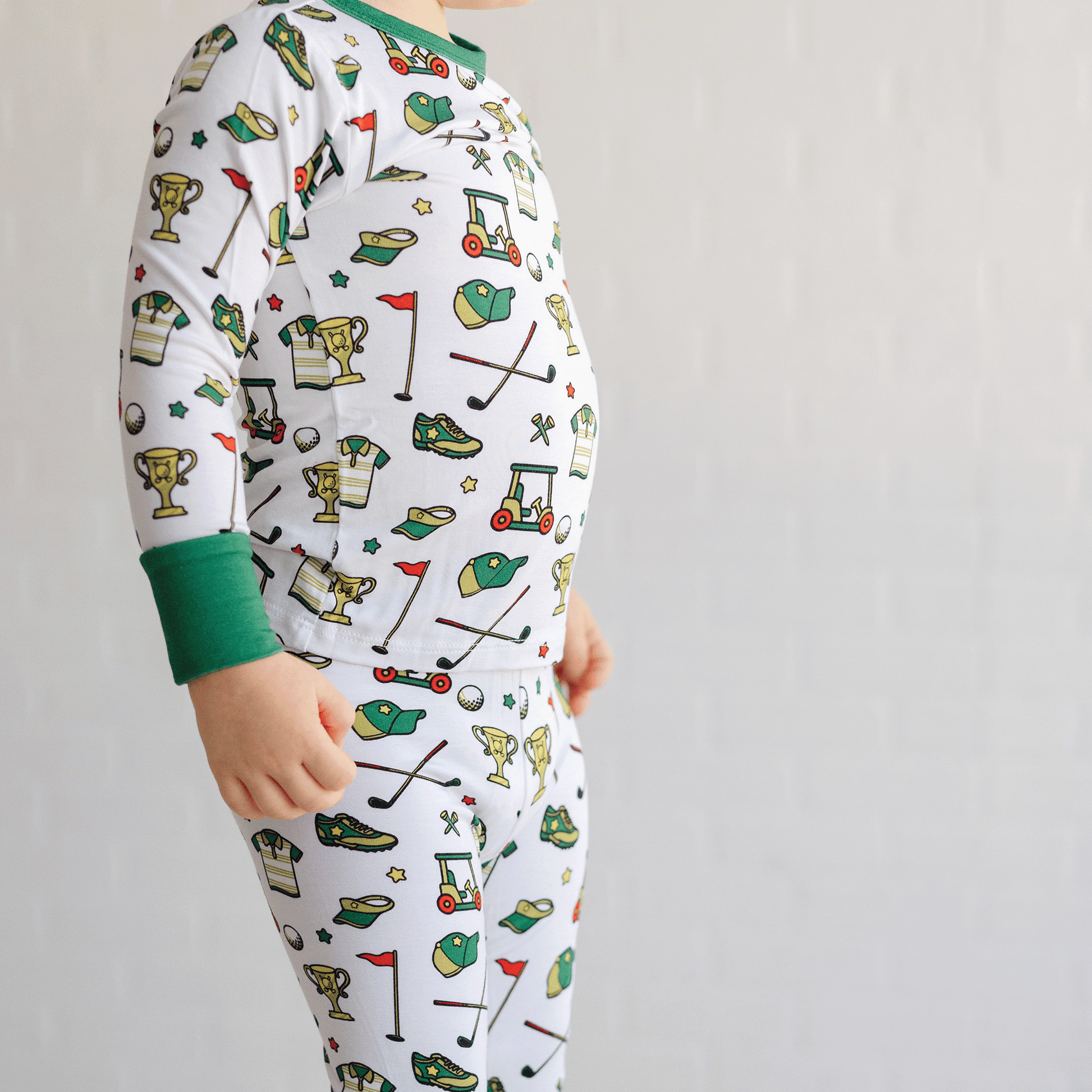 Golf-themed pajamas for toddler to youth sizes, made with soft bamboo fabric for a cozy and comfortable sleep.