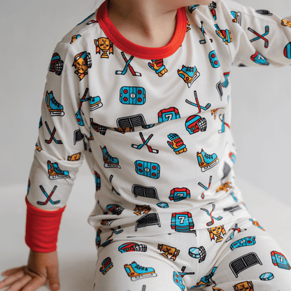 Hockey-themed pajamas for toddler to youth sizes, made with soft bamboo fabric for a cozy and comfortable sleep.