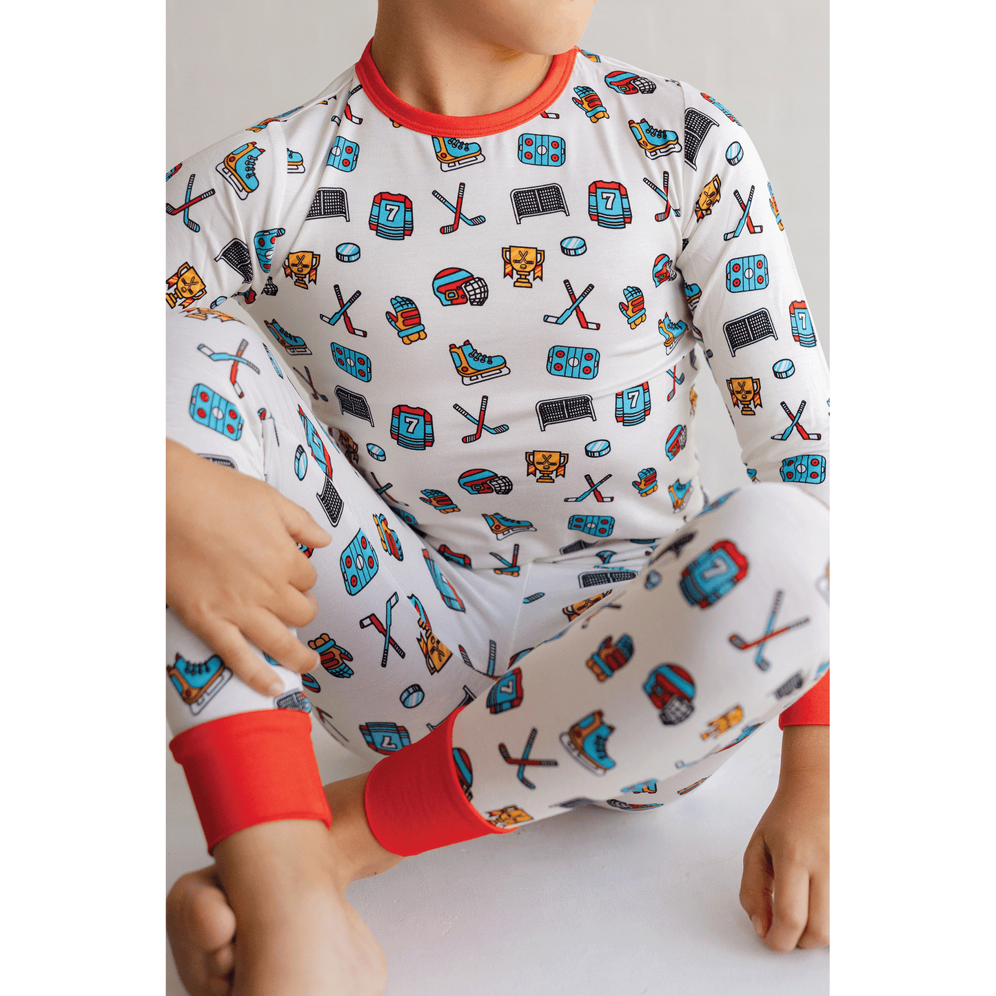 Hockey-themed pajamas for toddler to youth sizes, made with soft bamboo fabric for a cozy and comfortable sleep.