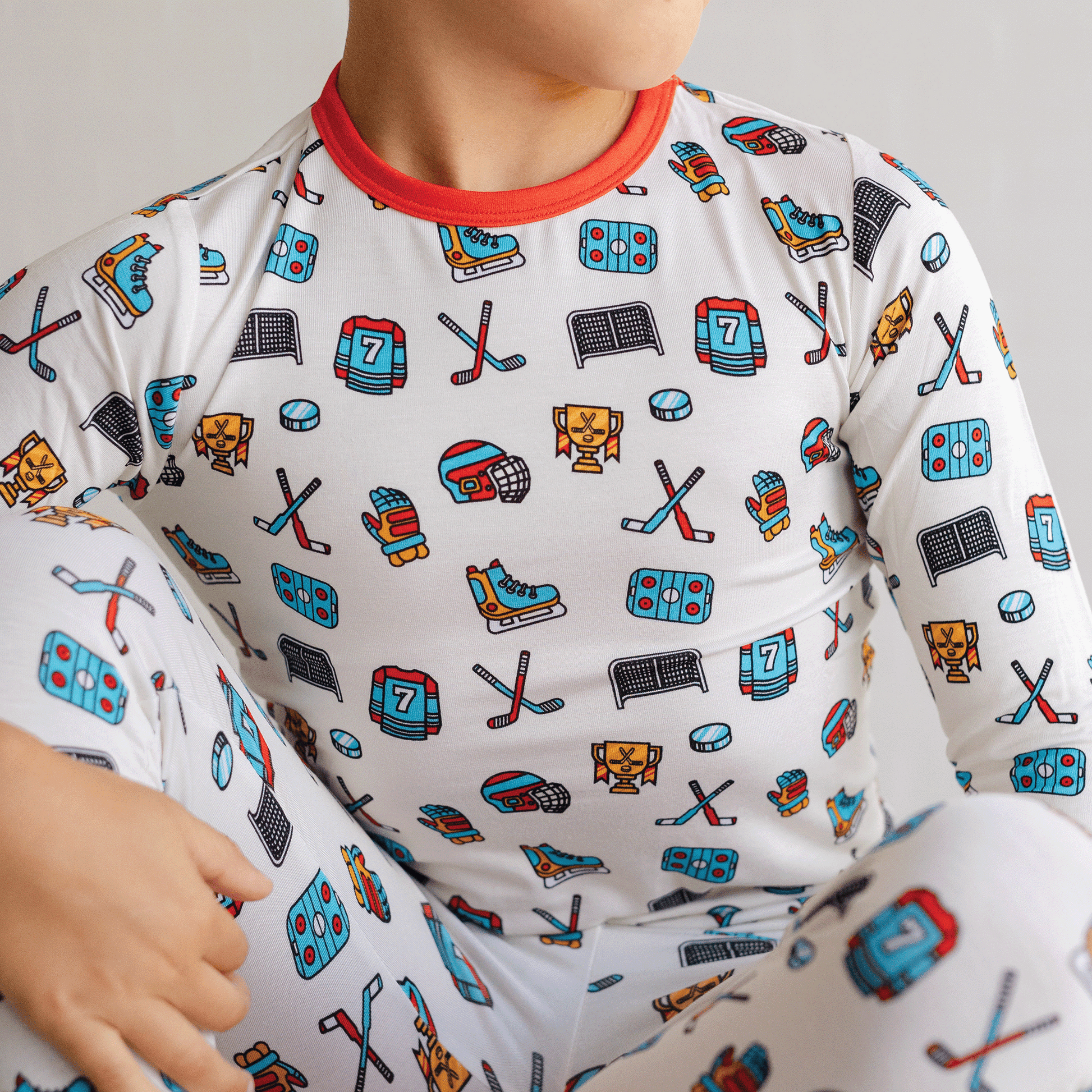 Hockey-themed pajamas for toddler to youth sizes, made with soft bamboo fabric for a cozy and comfortable sleep.