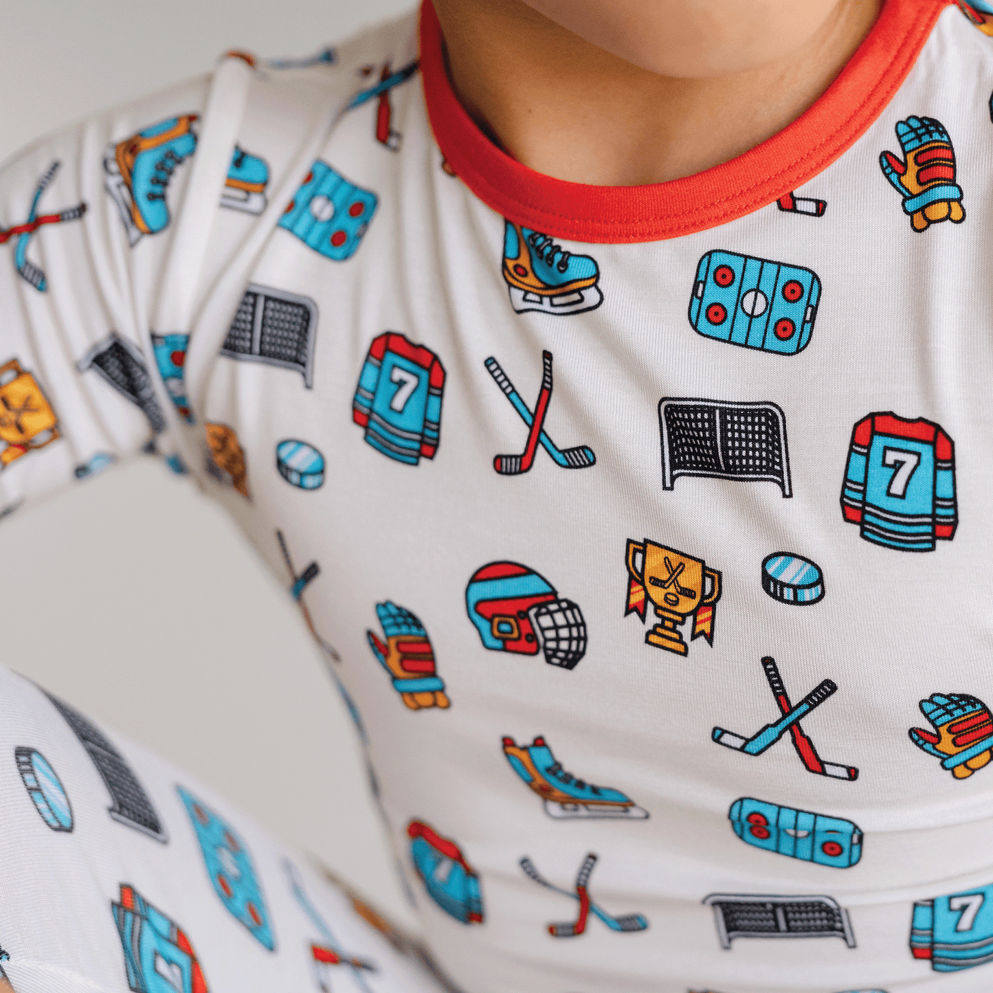 Hockey-themed pajamas for toddler to youth sizes, made with soft bamboo fabric for a cozy and comfortable sleep.