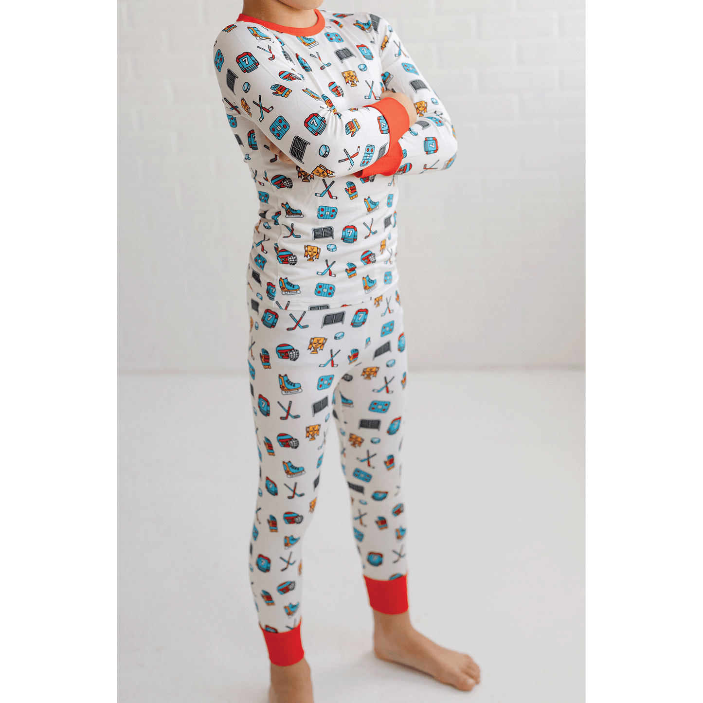 Hockey-themed pajamas for toddler to youth sizes, made with soft bamboo fabric for a cozy and comfortable sleep.