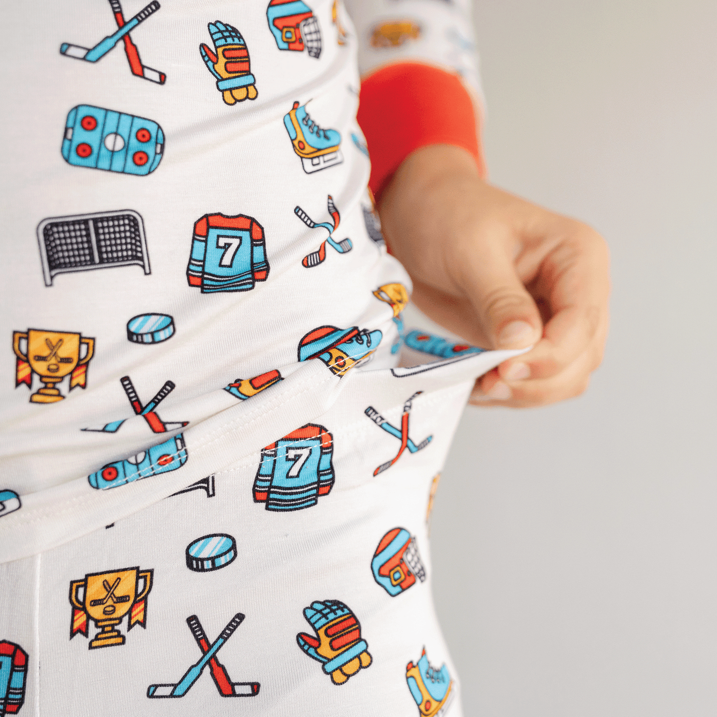 Hockey-themed pajamas for toddler to youth sizes, made with soft bamboo fabric for a cozy and comfortable sleep.