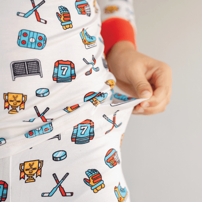 Hockey-themed pajamas for toddler to youth sizes, made with soft bamboo fabric for a cozy and comfortable sleep.