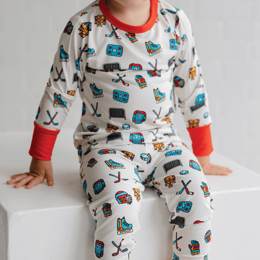 Hockey-themed pajamas for toddler to youth sizes, made with soft bamboo fabric for a cozy and comfortable sleep.