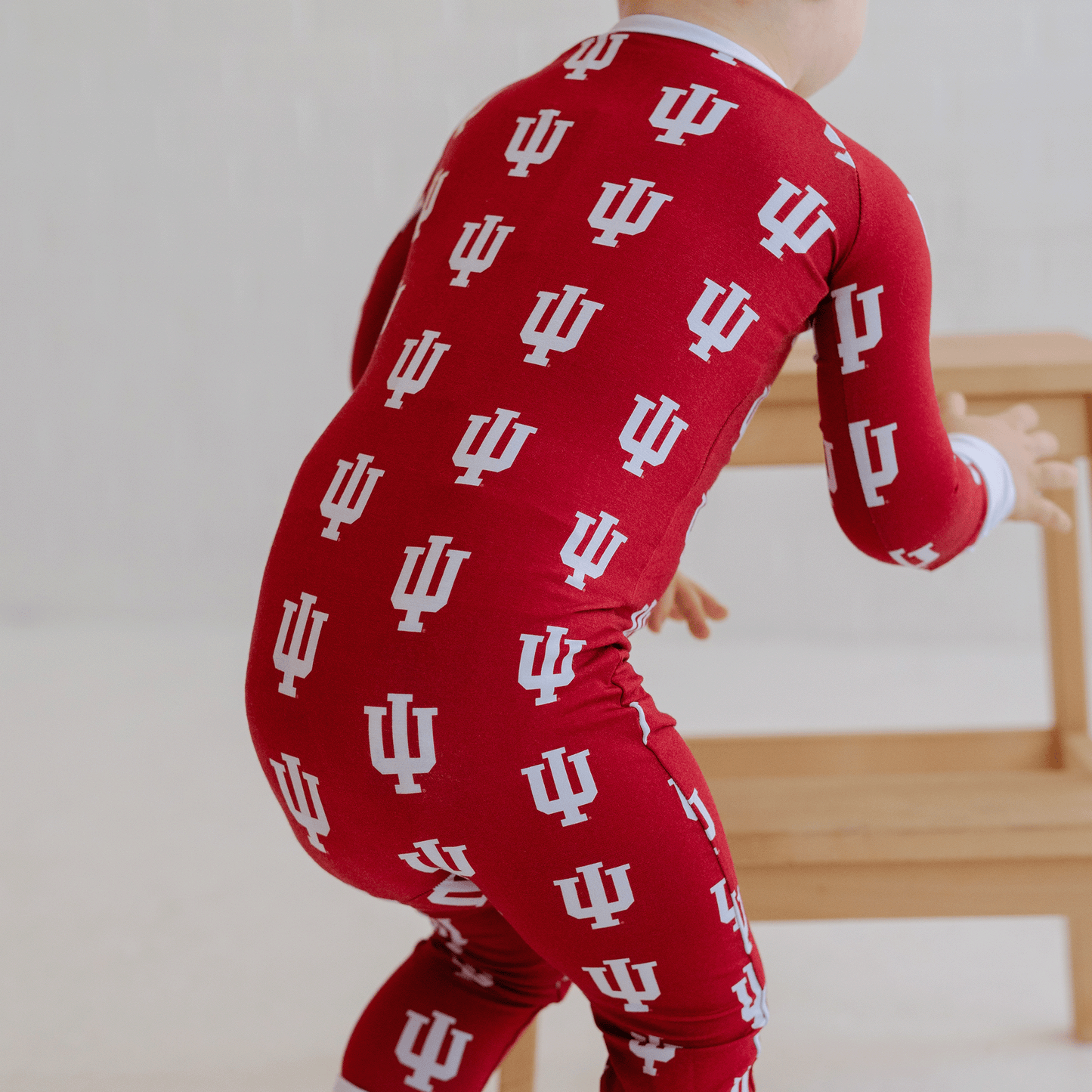 Indiana Hoosiers baby one-piece with official team logo, soft bamboo fabric, and double zippers for easy diaper changes.