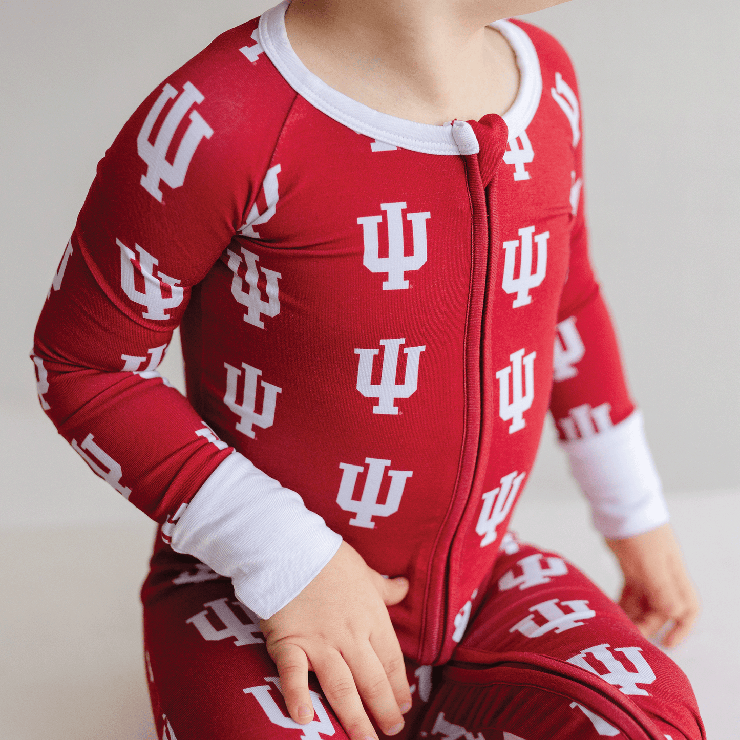 Indiana Hoosiers baby one-piece with official team logo, soft bamboo fabric, and double zippers for easy diaper changes.