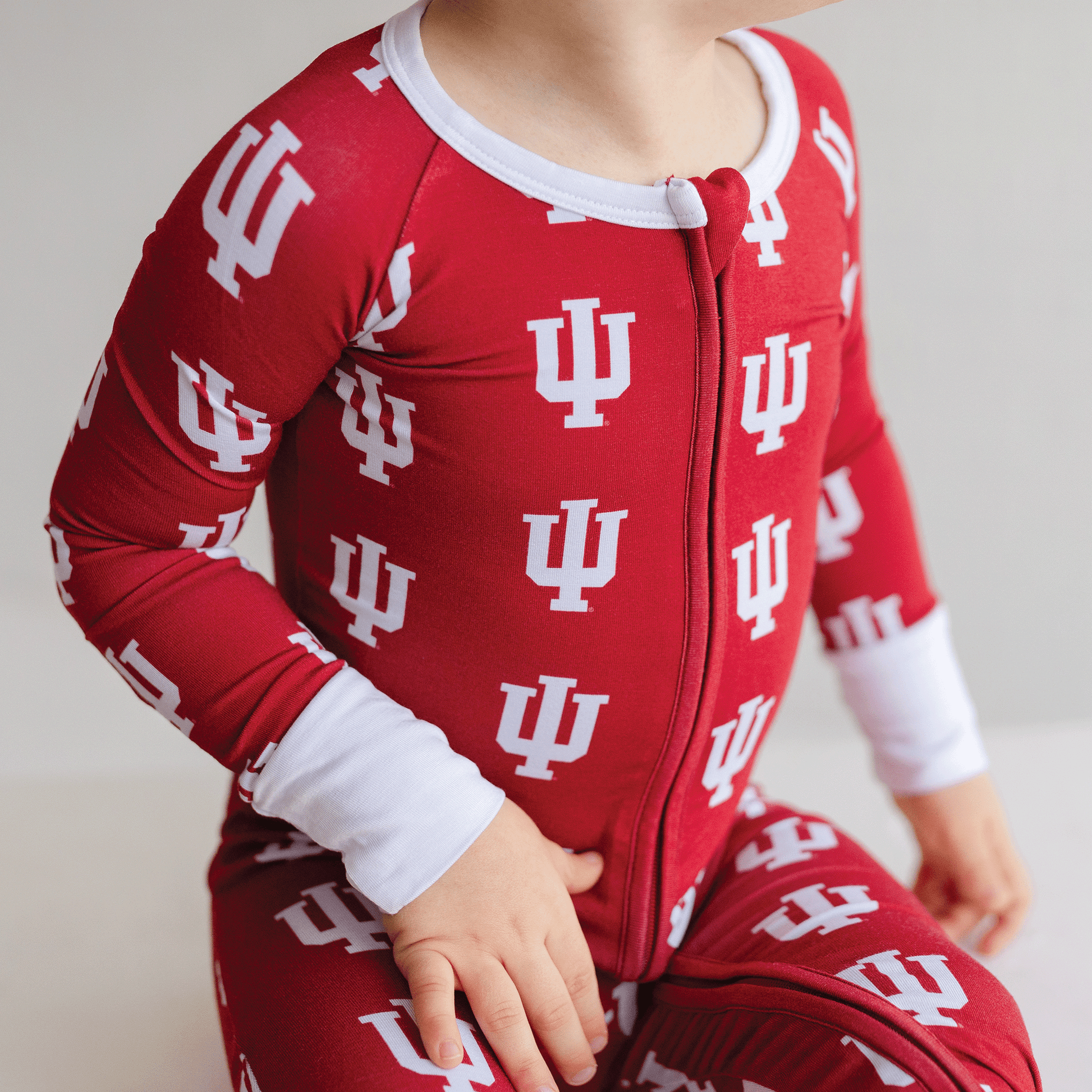 Indiana Hoosiers baby one-piece with official team logo, soft bamboo fabric, and double zippers for easy diaper changes.