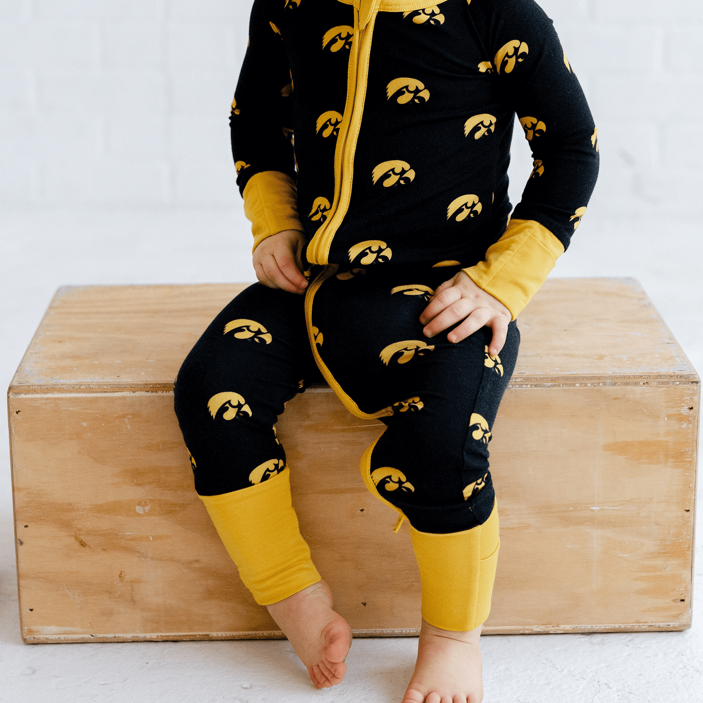 Iowa Hawkeyes one-piece with official team logo, soft bamboo fabric, and double zippers for easy diaper changes.