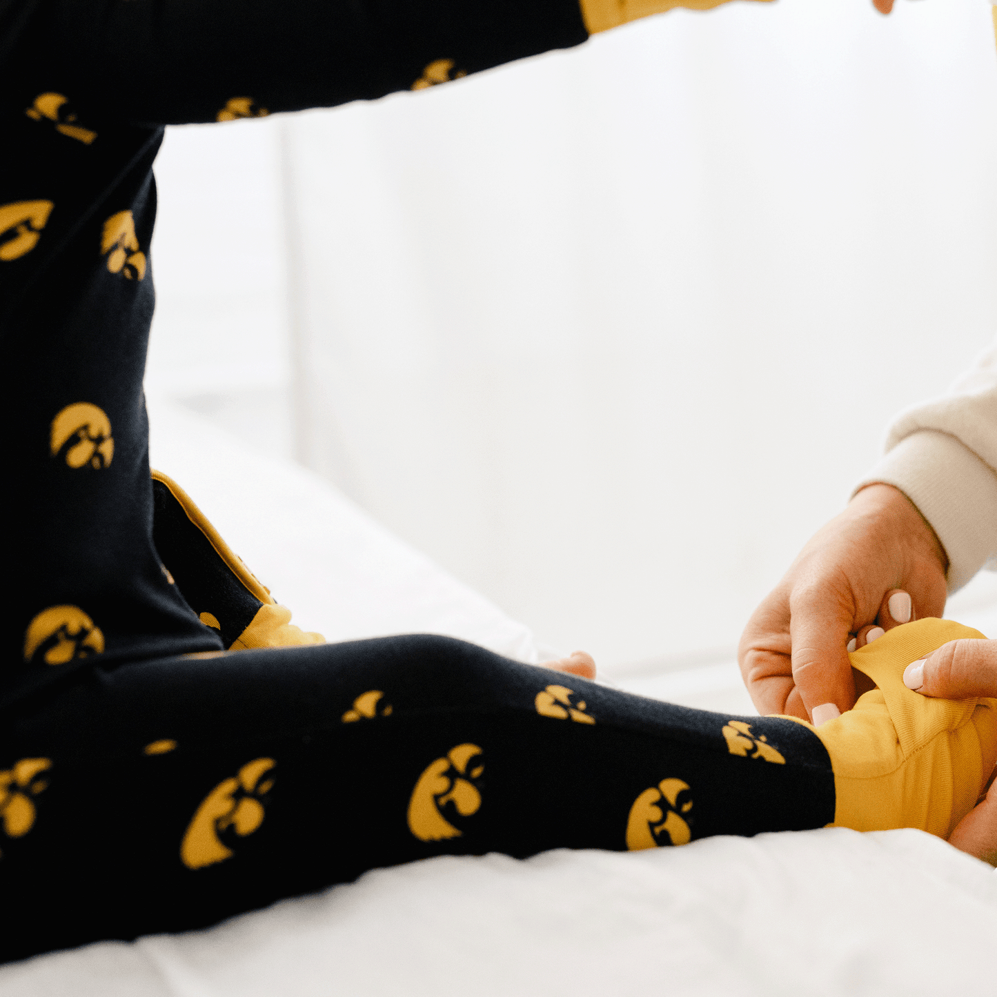 Iowa Hawkeyes one-piece with official team logo, soft bamboo fabric, and double zippers for easy diaper changes.