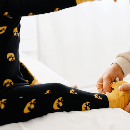 Iowa Hawkeyes one-piece with official team logo, soft bamboo fabric, and double zippers for easy diaper changes.