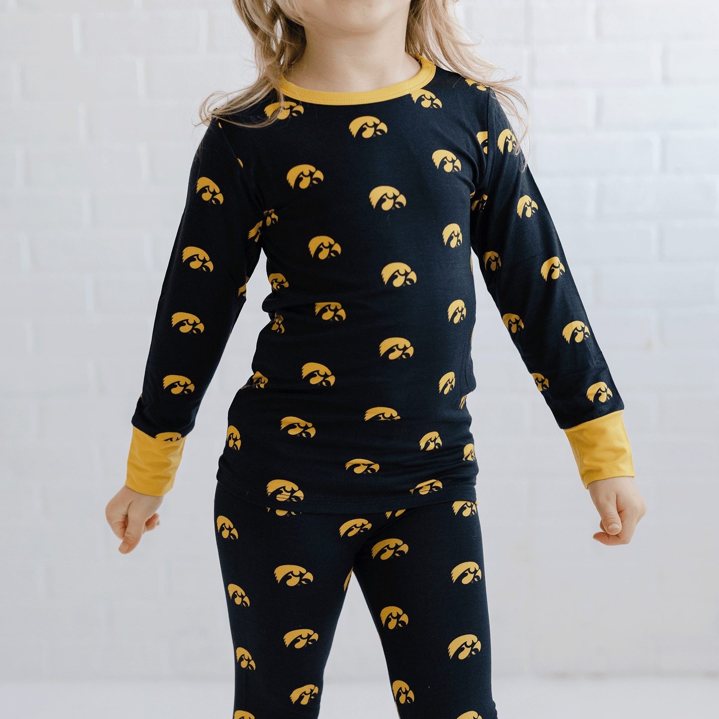 Iowa Hawkeyes pajamas for toddler to youth with official team logo, soft bamboo fabric, and a snug fit.