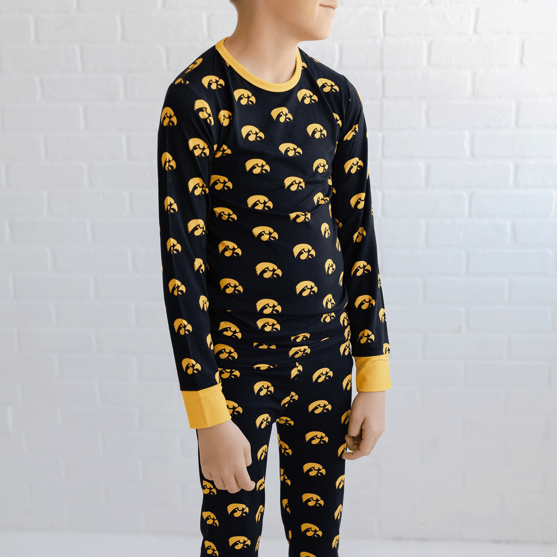 Iowa Hawkeyes pajamas for toddler to youth with official team logo, soft bamboo fabric, and a snug fit.