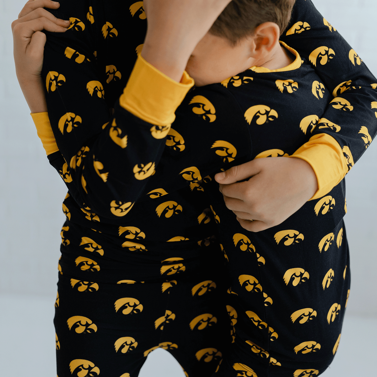 Iowa Hawkeyes pajamas for toddler to youth with official team logo, soft bamboo fabric, and a snug fit.