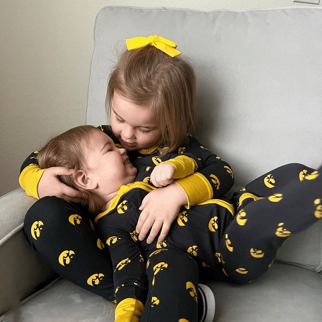 Iowa Hawkeyes officially licensed two-piece pajama set for toddlers and kids. Made from soft bamboo fabric with Hawkeyes logo, perfect for comfortable sleep and showing team pride.