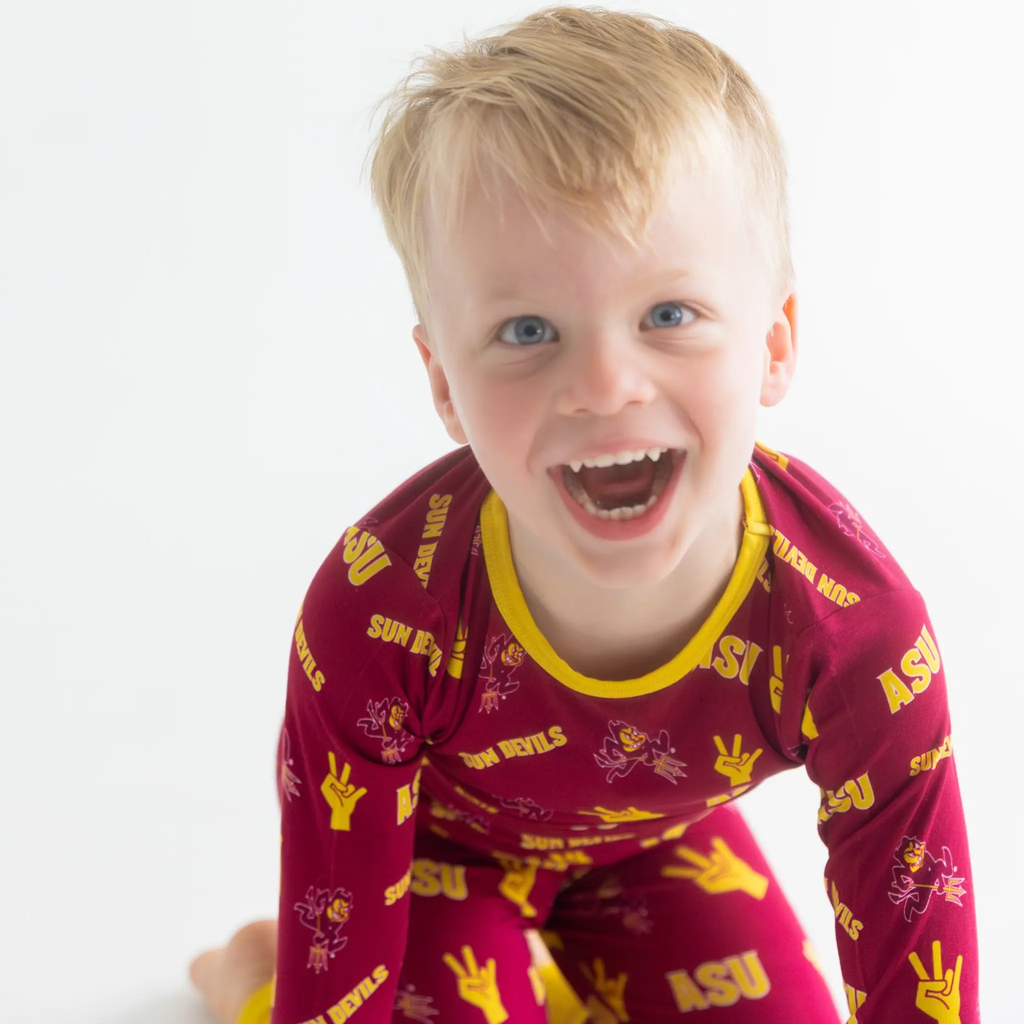 Little Fan Repping Asu In Officially licensed bamboo Pajamas Tailgate Tikes with bamboo.