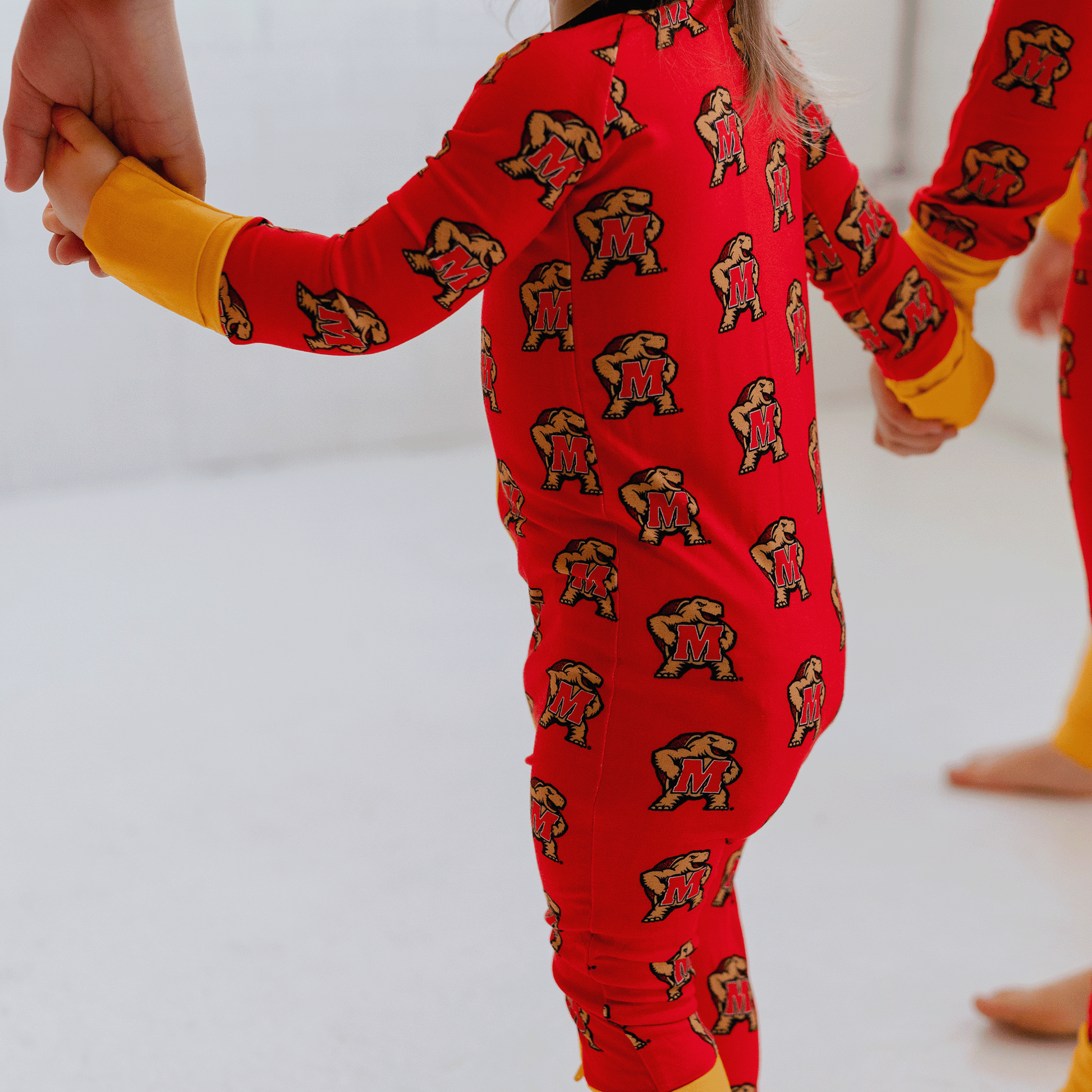 Maryland Terrapins baby one-piece with official team logo, soft bamboo fabric, and double zippers for easy diaper changes.