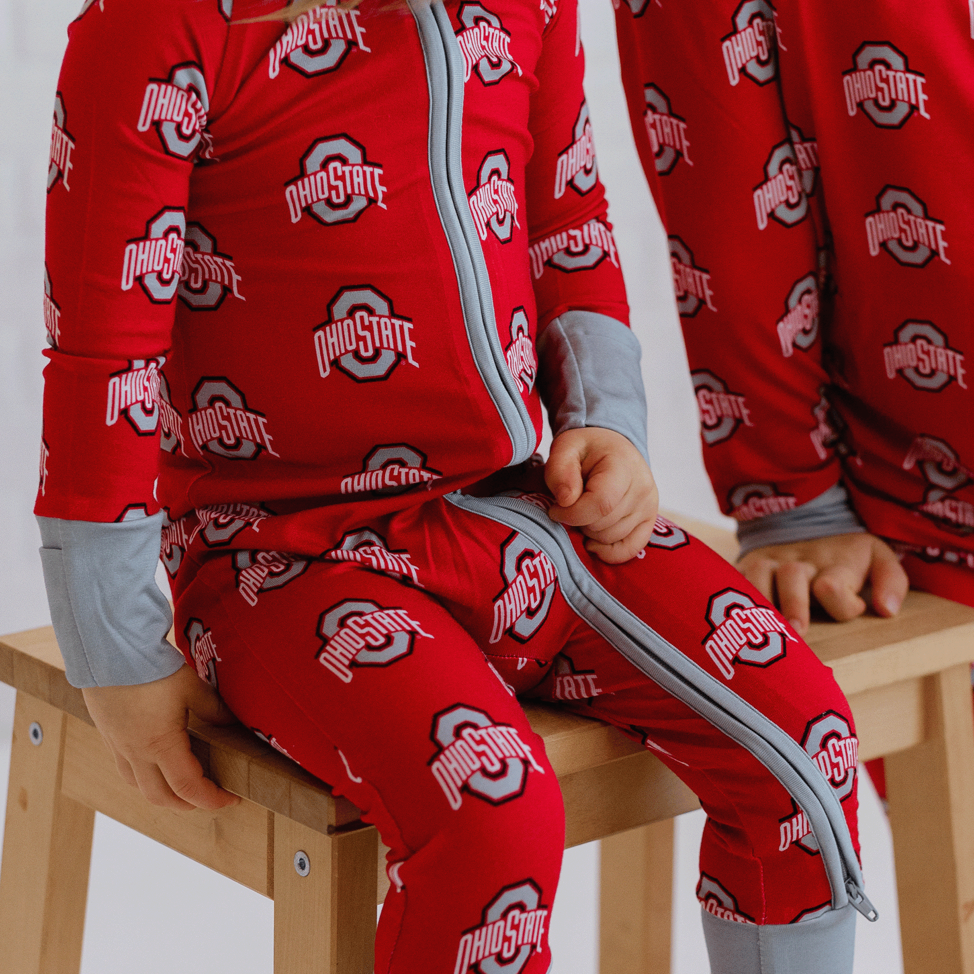 Ohio State Buckeyes one-piece with official team logo, soft bamboo fabric, and double zippers for easy changes.