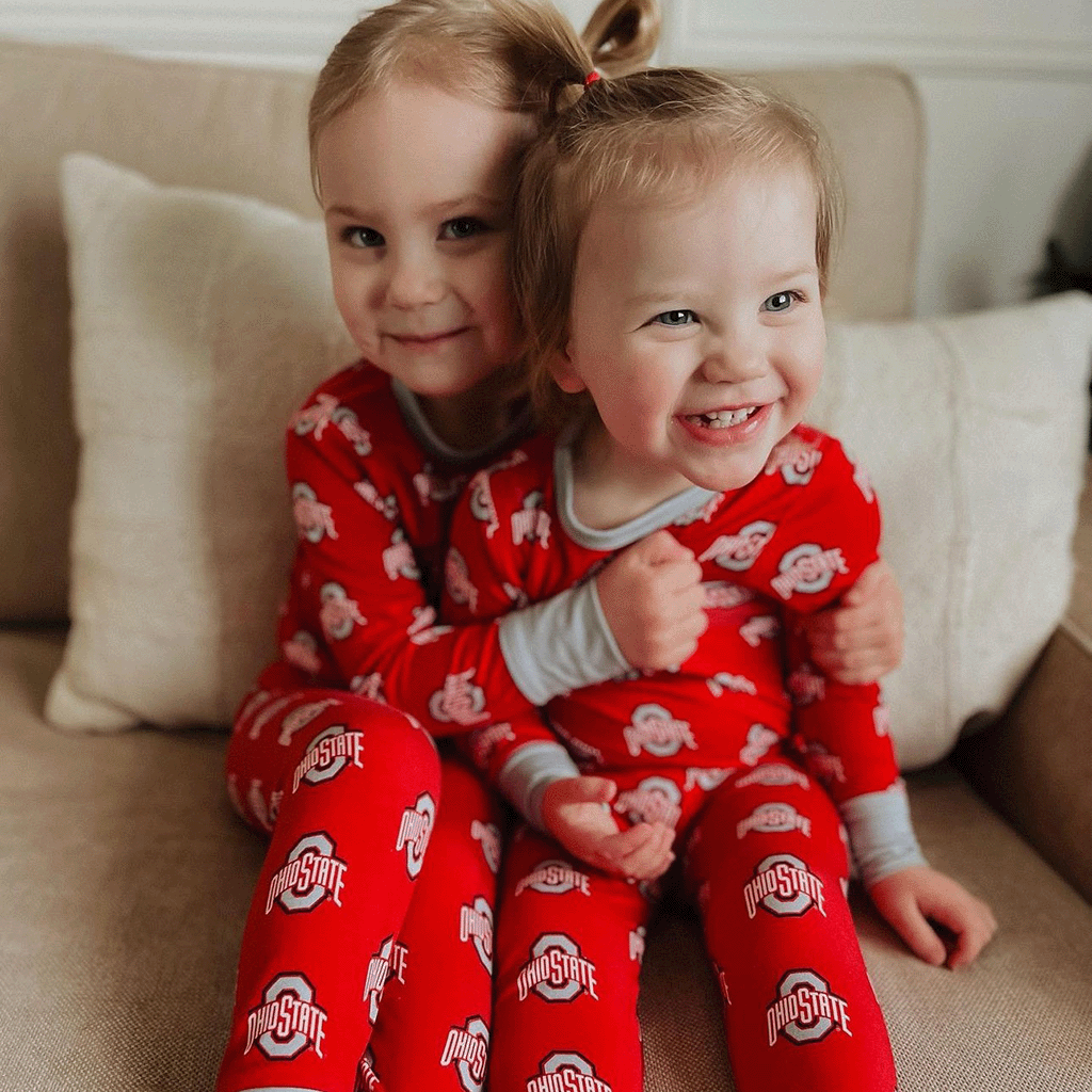 Ohio State Buckeyes officially licensed two-piece pajama set for toddlers and kids. Made from soft bamboo fabric with Buckeyes logo, offering comfort and school spirit for young fans.