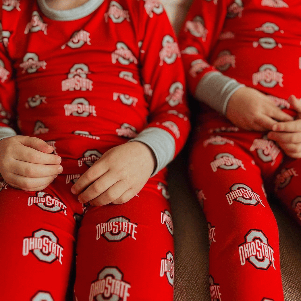 Ohio State Buckeyes officially licensed two-piece pajama set for toddlers and kids. Made from soft bamboo fabric with Buckeyes logo, offering comfort and school spirit for young fans.