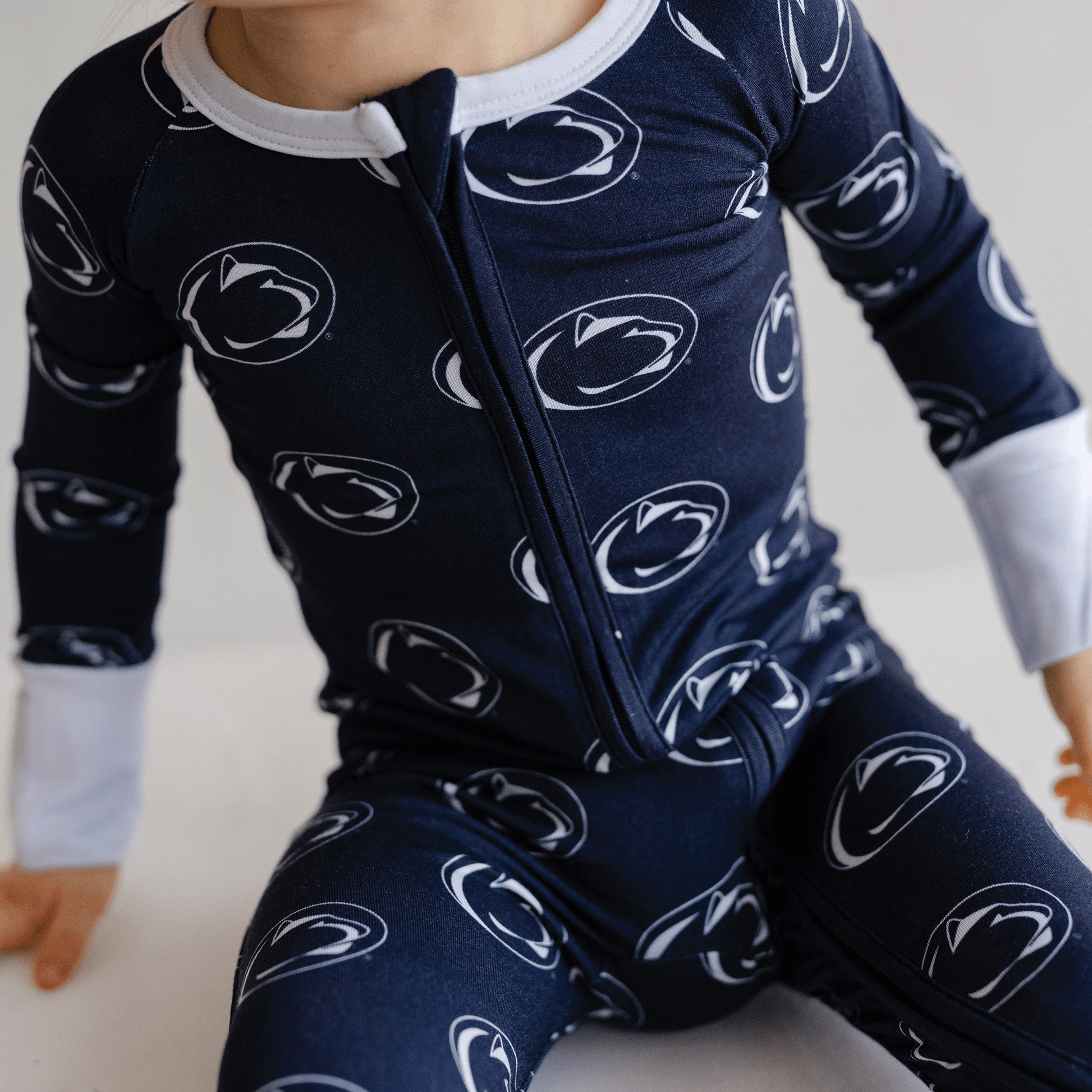 Penn State Nittany Lions baby one-piece with official team logo, soft bamboo fabric, and double zippers for easy diaper changes.