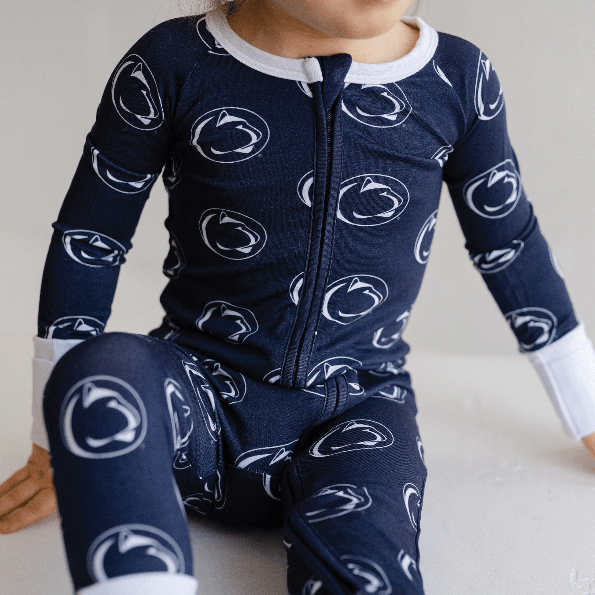 Penn State Nittany Lions baby one-piece with official team logo, soft bamboo fabric, and double zippers for easy diaper changes.