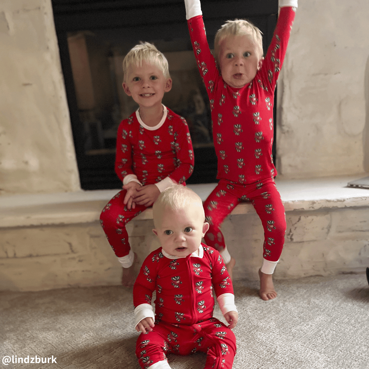 Wisconsin Badgers kids wearing bamboo pajamas with bucky badger print.
