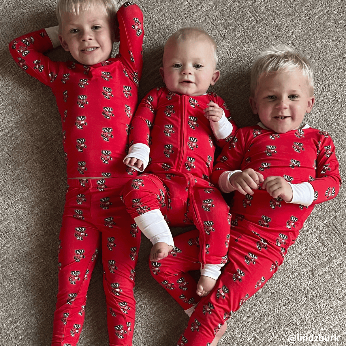 Wisconsin Badgers kids wearing bamboo pajamas with bucky badger print.