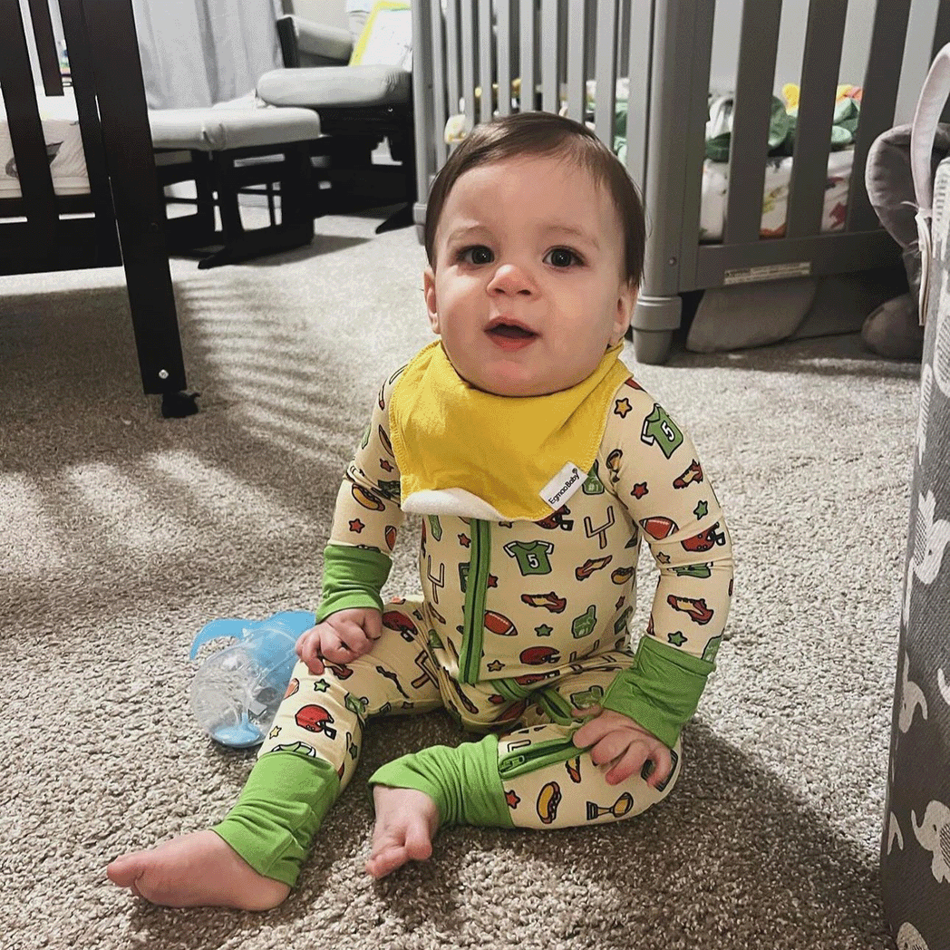 Football Tailgate Tikes Football One-Piece for baby to toddler with soft bamboo fabric and a snug fit in a football.