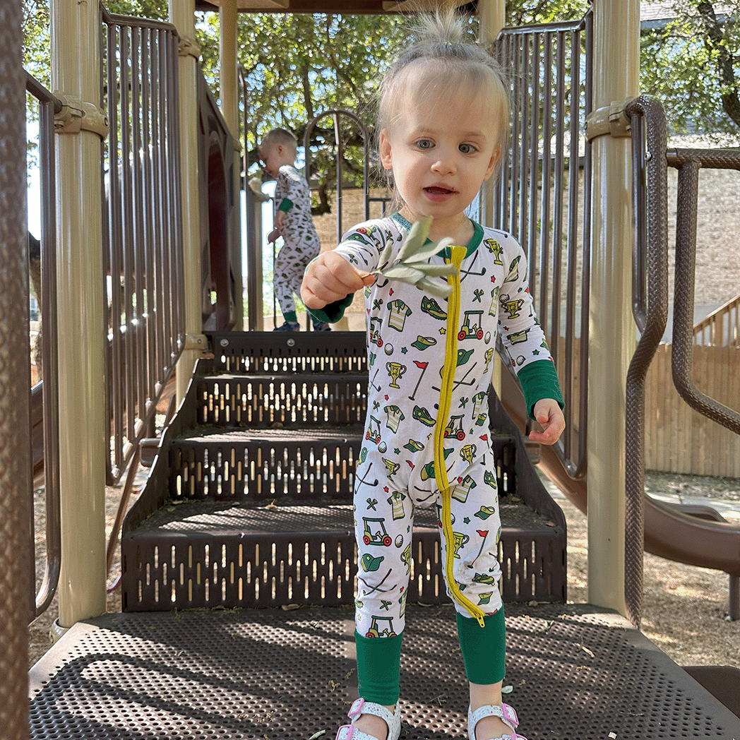 Golf Tailgate Tikes Golf One-Piece sleeper for baby to toddler with soft bamboo fabric and a snug fit in a golf print.