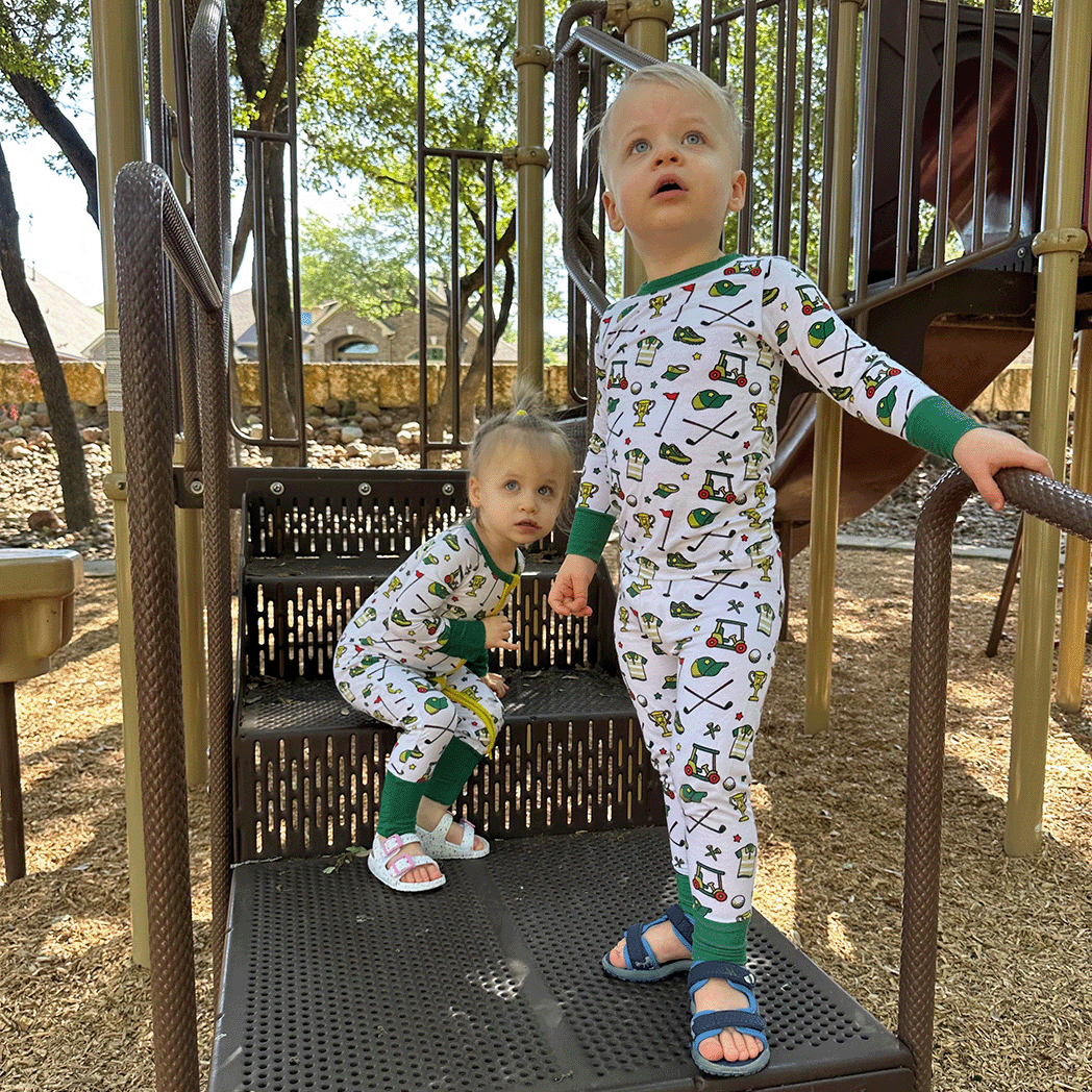 Tailgate Tikes Golf pajamas and one-piece for baby to youth with soft bamboo fabric, and a snug fit in a golf print.