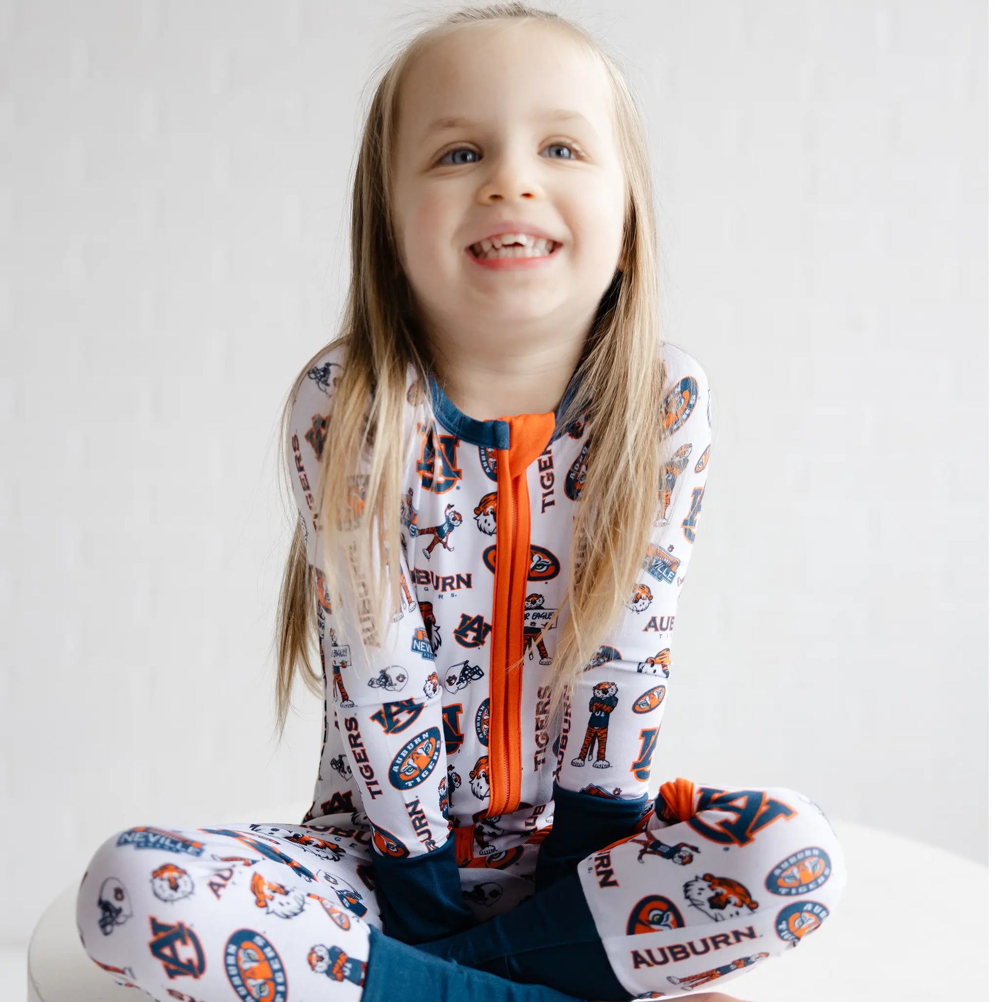 Auburn Tigers baby footie pajamas with an all-over logo print for game day.