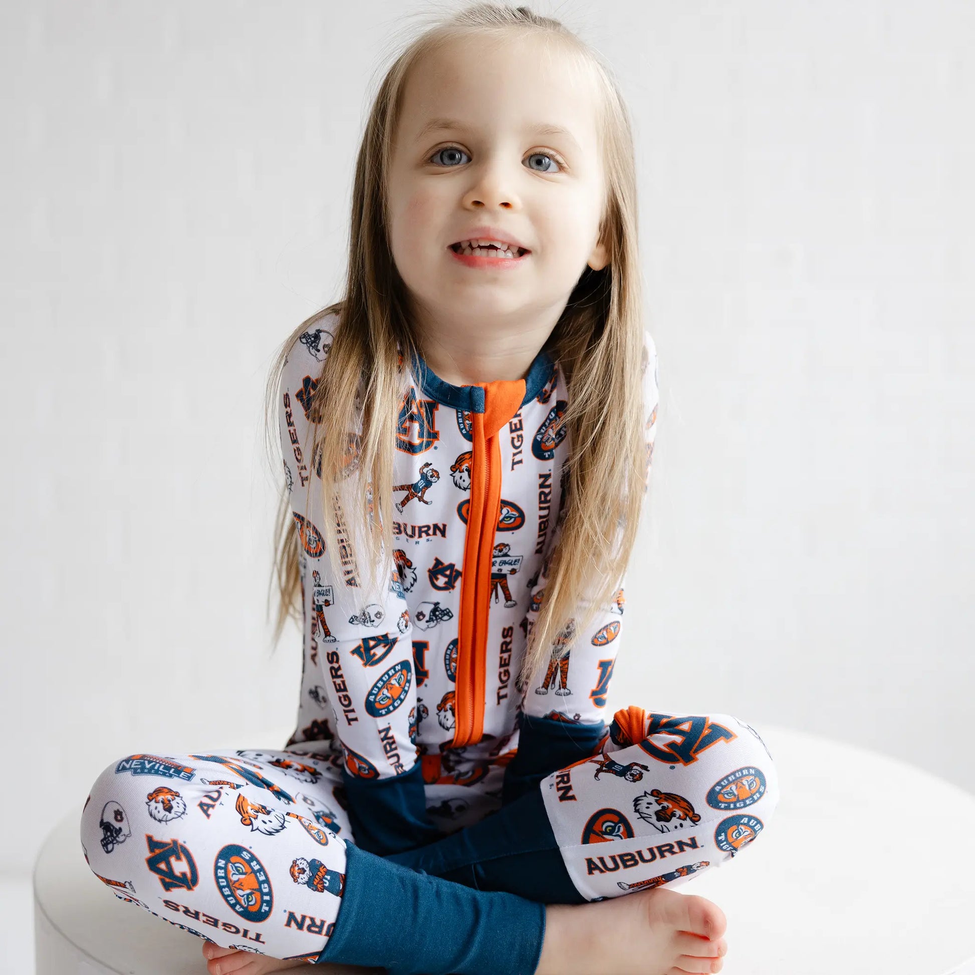 Auburn Tigers baby game day outfit featuring a cozy bamboo one-piece sleeper.