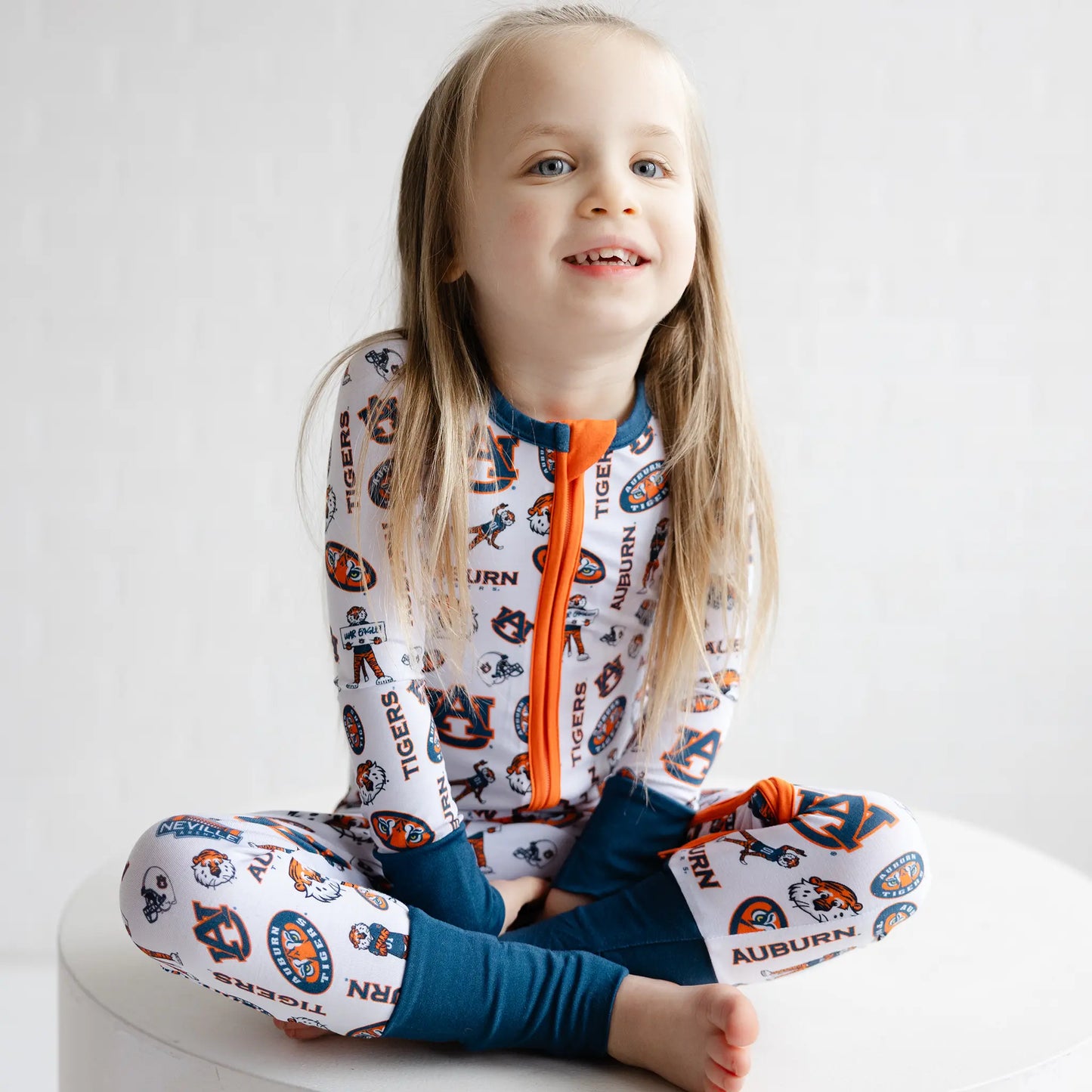 Detail view of Auburn Tigers infant bamboo pajamas with team logo print and soft fabric.
