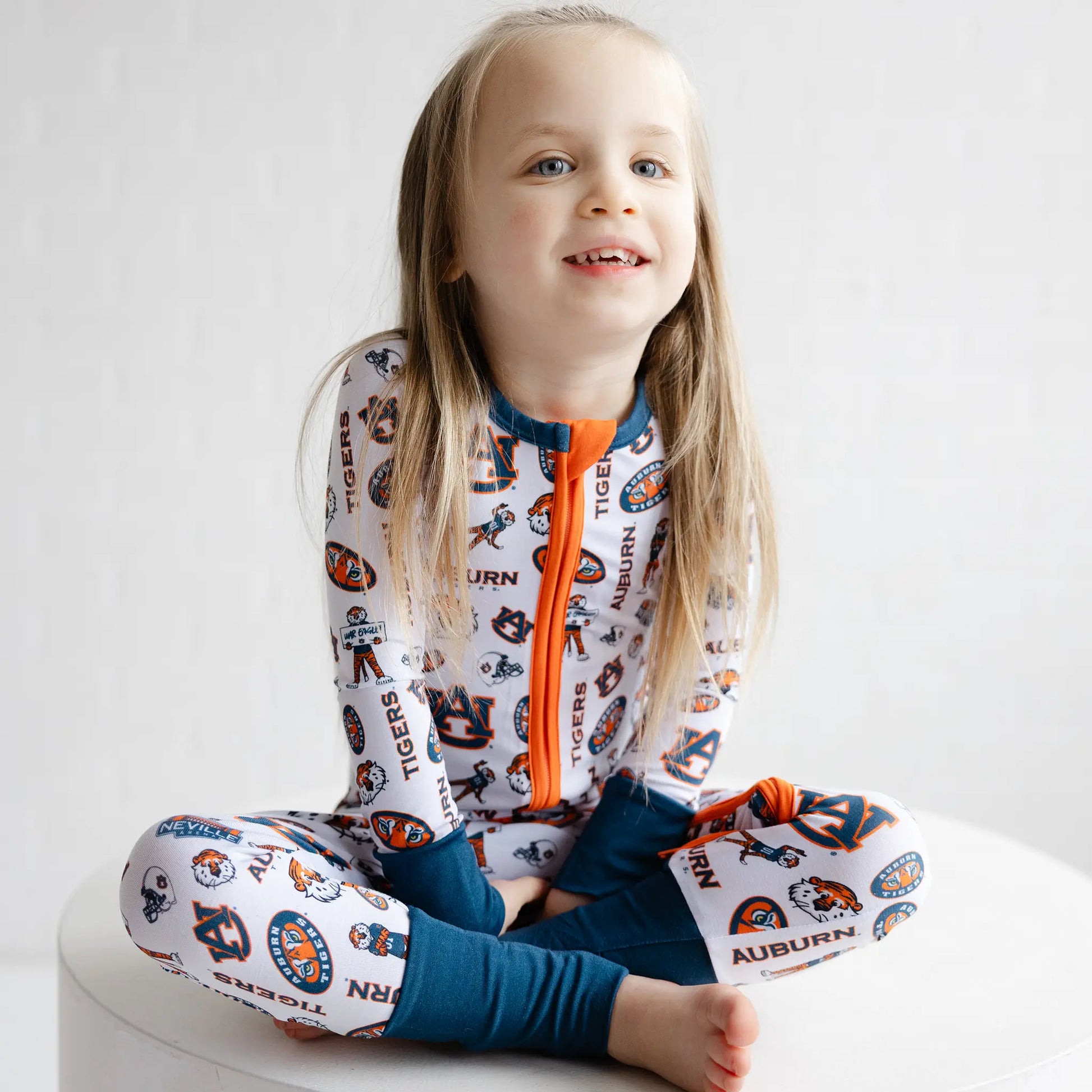 Detail view of Auburn Tigers infant bamboo pajamas with team logo print and soft fabric.