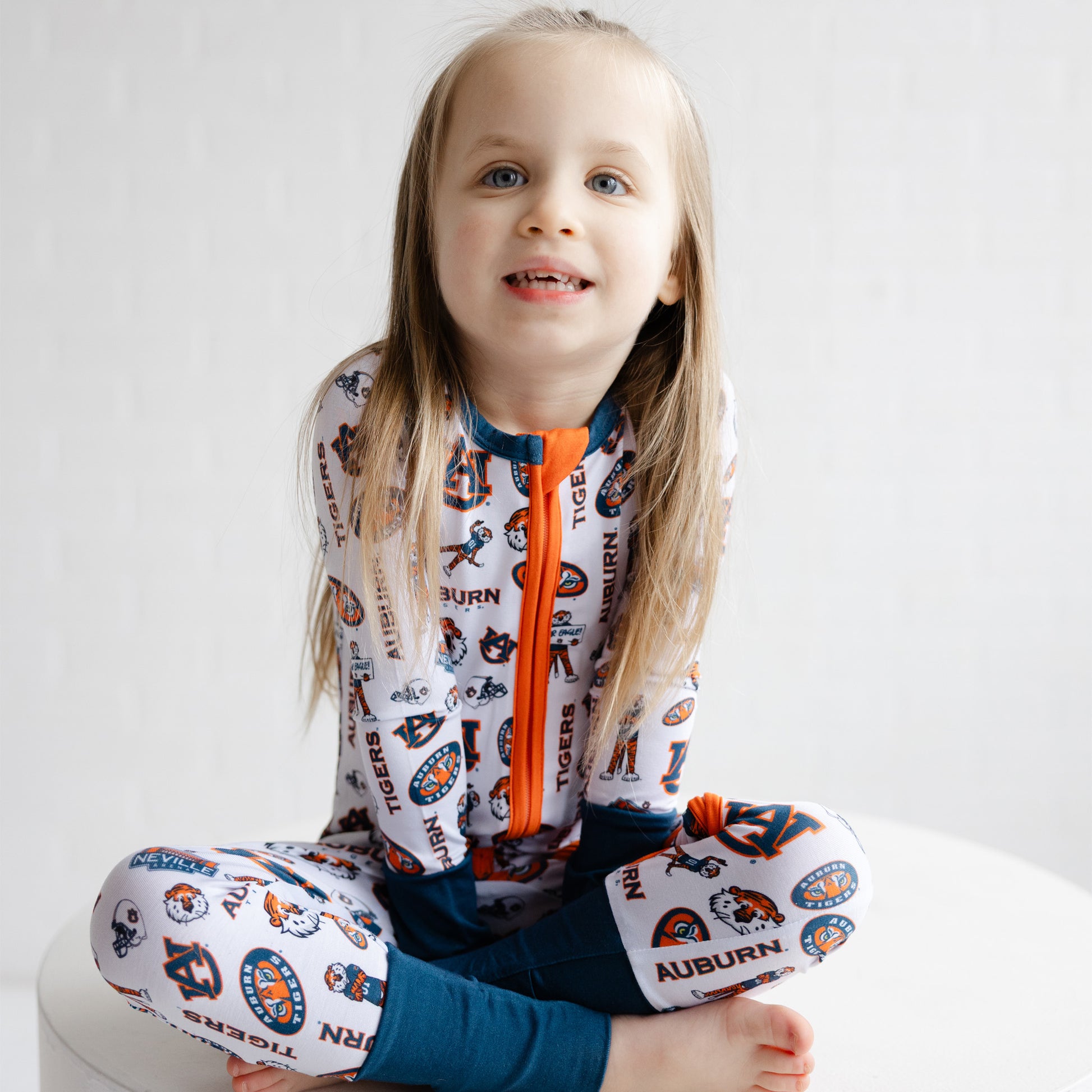 Soft Auburn Tigers collegiate one-piece pajamas for newborns, babies, and toddlers