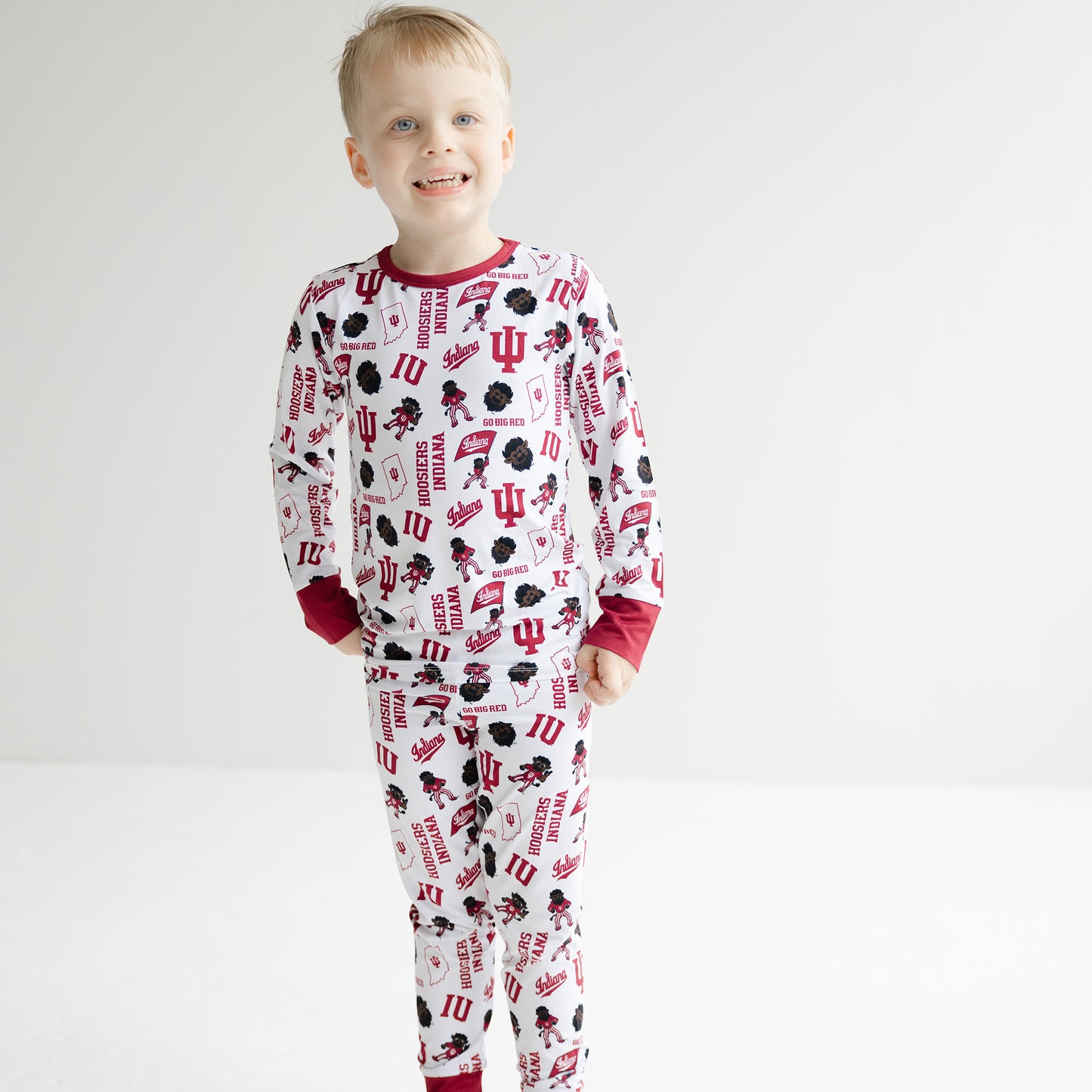 Toddler wearing Indiana Hoosiers bamboo pajama set with matching long sleeve shirt and pajama pants.