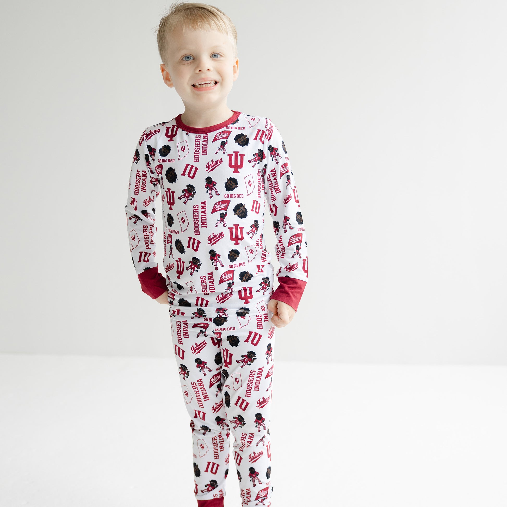 Toddler wearing Indiana Hoosiers bamboo pajama set with matching long sleeve shirt and pajama pants.