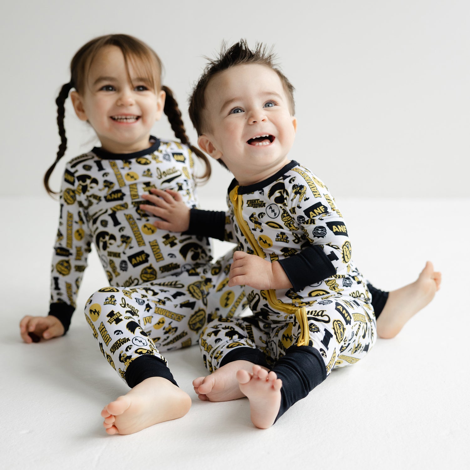 Iowa Hawkeyes baby zip sleeper featuring officially licensed Hawkeyes print