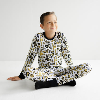 Iowa Hawkeyes white bamboo pajama set featuring all-over black and gold team branding