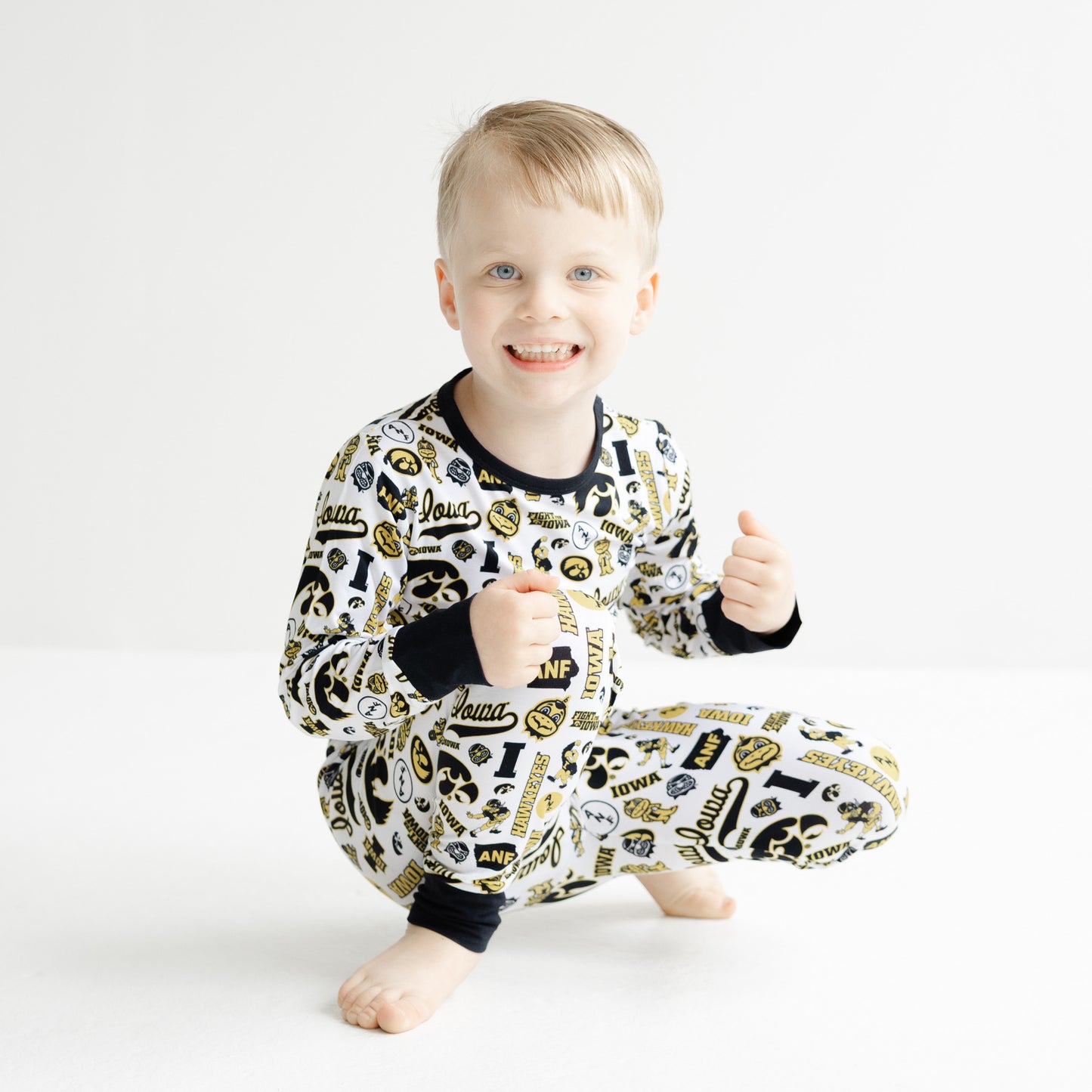 Iowa Hawkeyes kids bamboo two-piece pajama set with white all-over team print