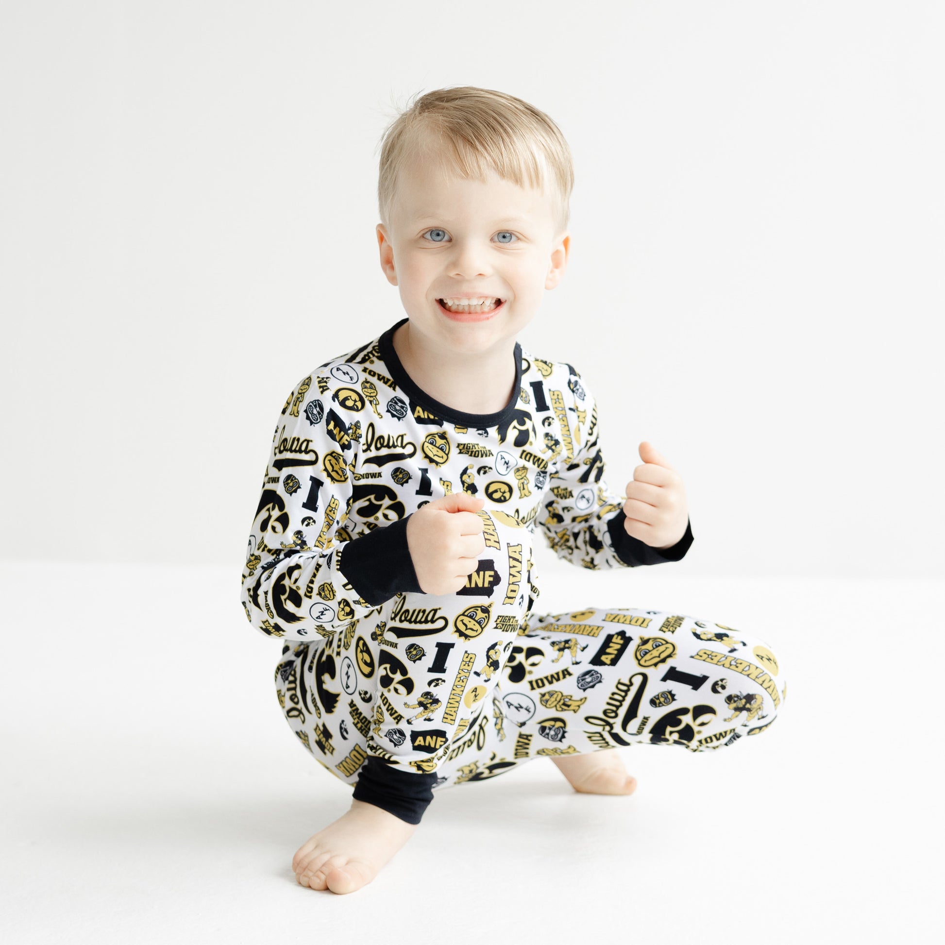 Iowa Hawkeyes kids bamboo two-piece pajama set with white all-over team print