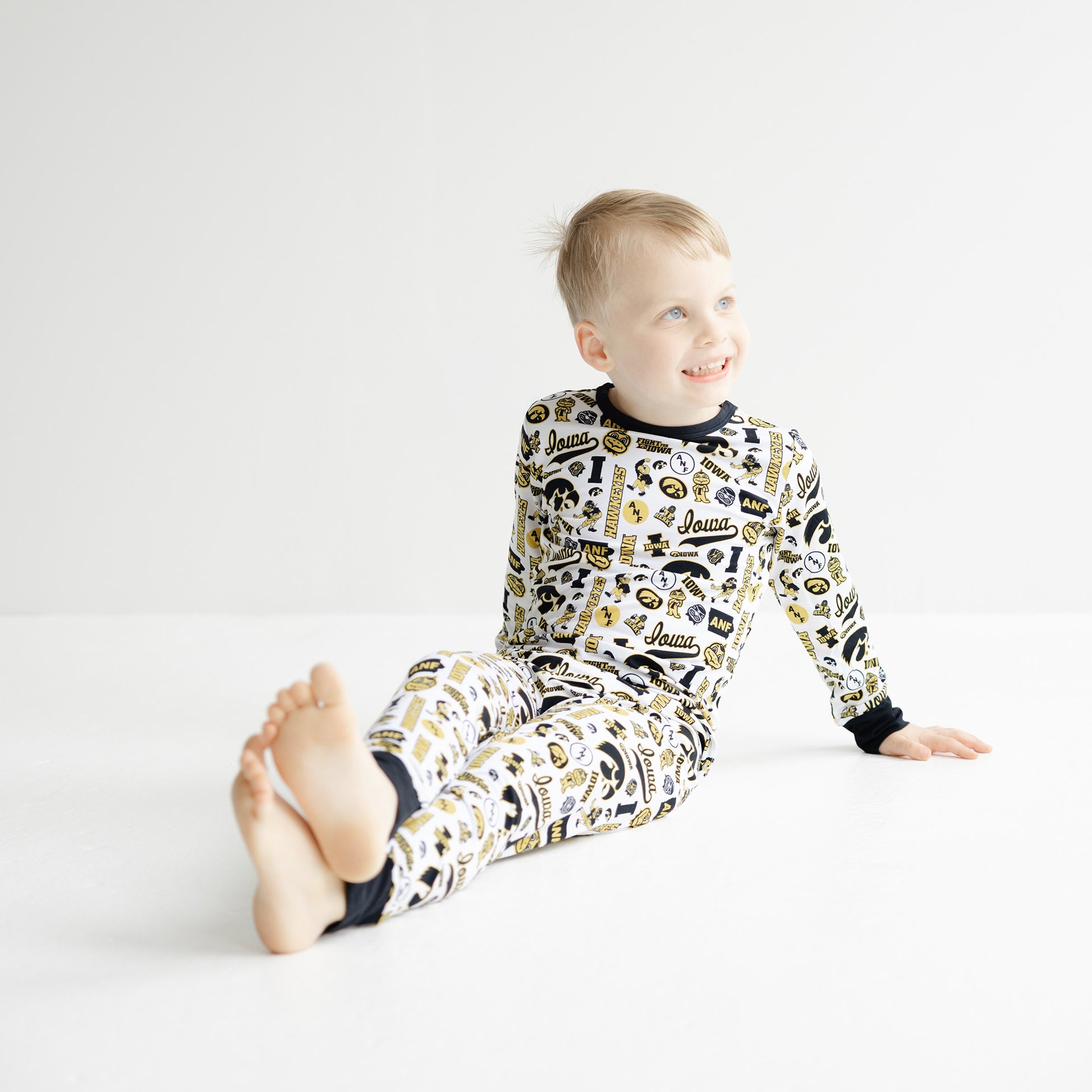 Iowa Hawkeyes kids pajama set with all-over Tigerhawk and team logo print