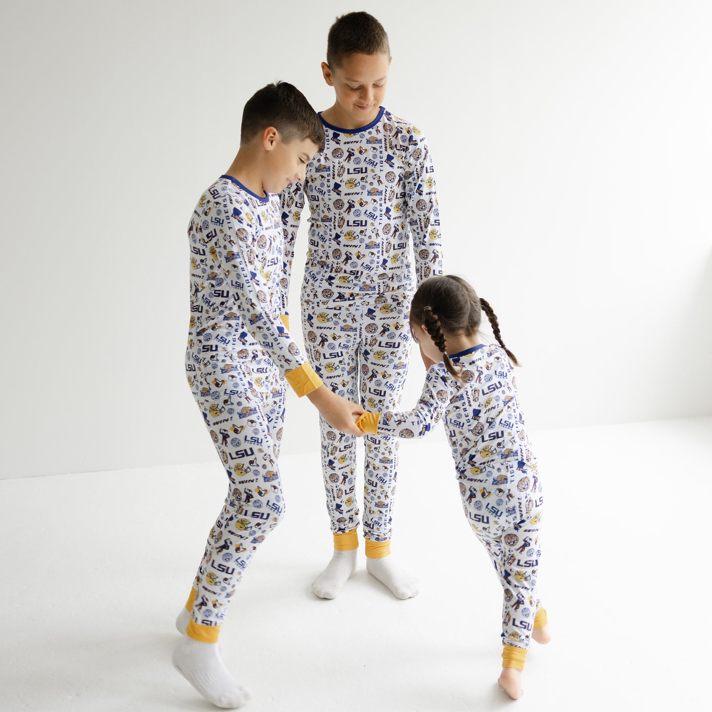 White LSU Tigers bamboo pajamas with purple and gold cuffs for young fans