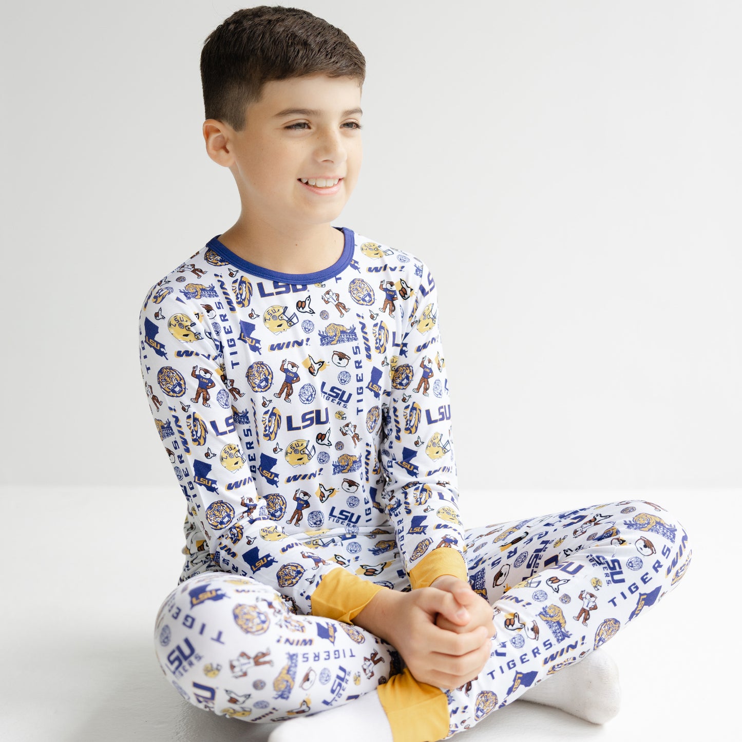 LSU Tigers toddler pajamas with white background purple trim and gold details