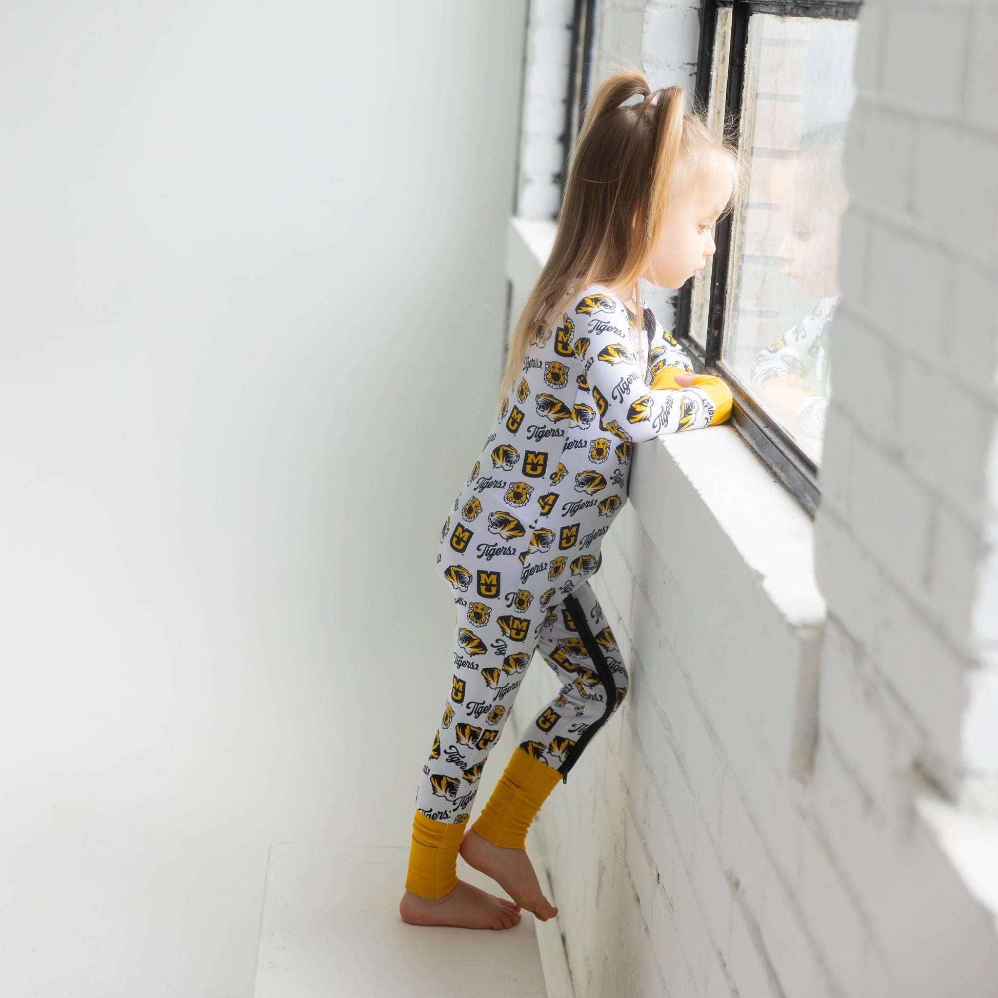 Missouri Tigers Missouri Tigers bamboo Long Sleeve Zipper Onesie and all over Mizzou print.